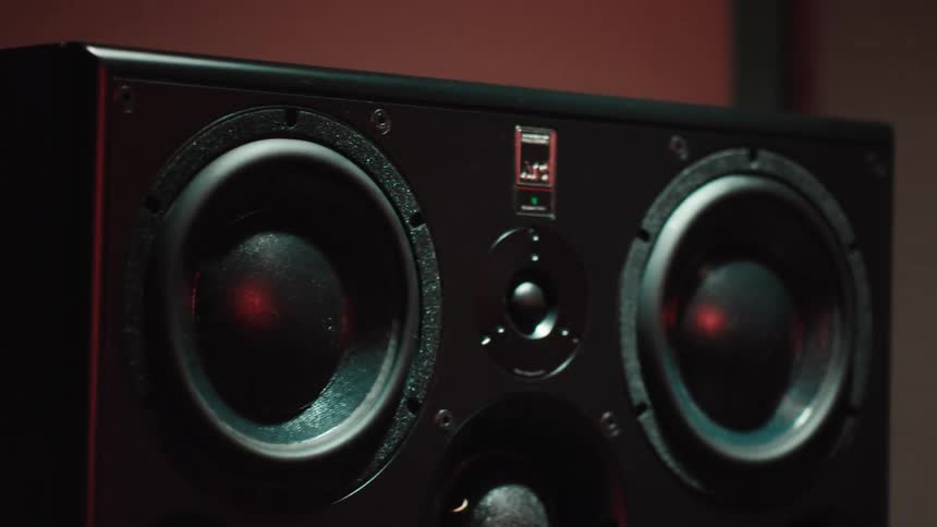 A large black speaker box has two speakers