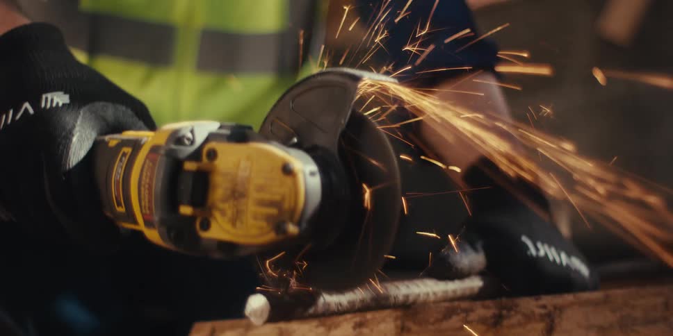 A man is using an angle saw