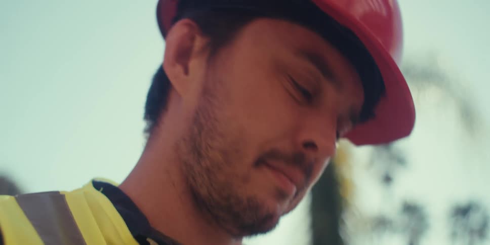 A man is writing on his clipboard