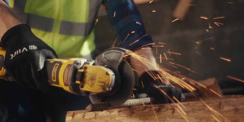 A worker is cutting rebar