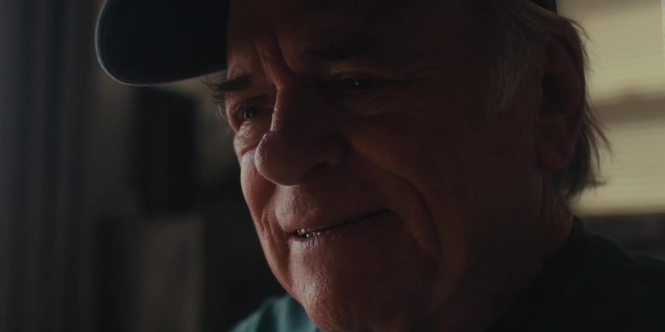 Elderly man in cap happy and excited at the same time