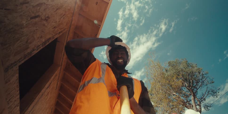 Point of view shot of a worker using a shovel on a construction site
