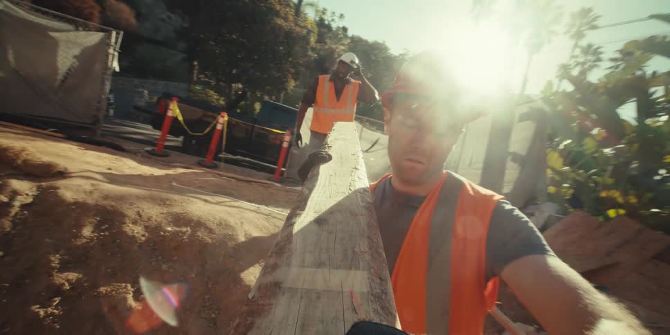A footage of people lifting a wood