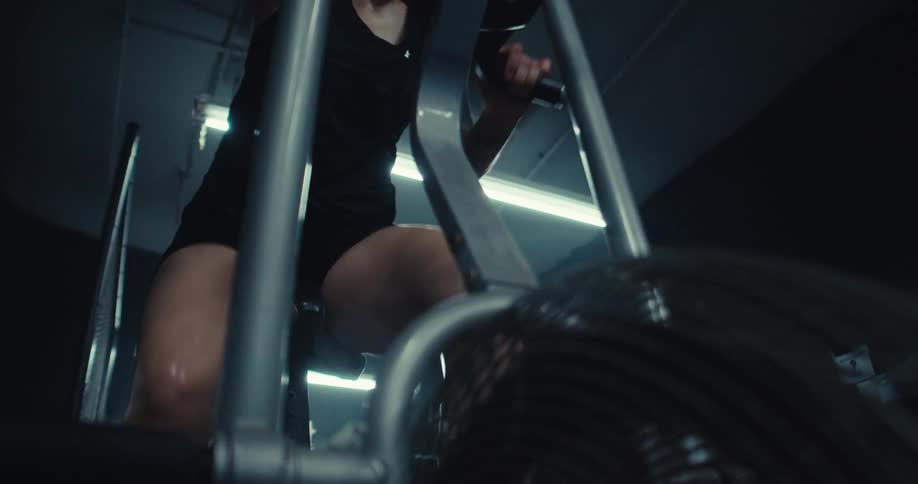 Body of a woman performing aerobic exercise on an exercise bike