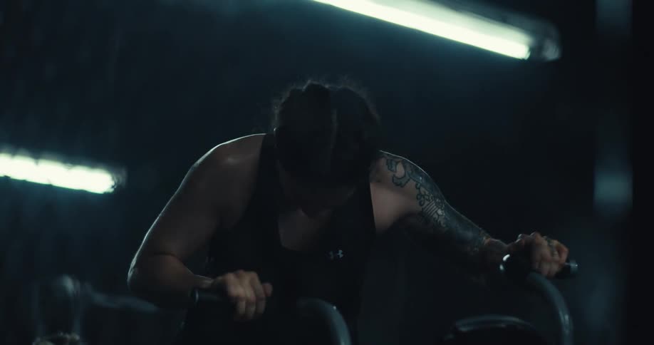 A woman is sweating as she exercises
