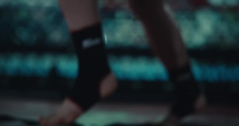 Close up of a persons feet jumping and warming up