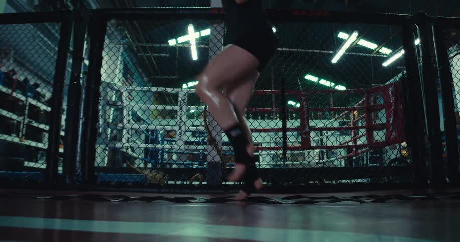 A woman is running and sweating in the gym