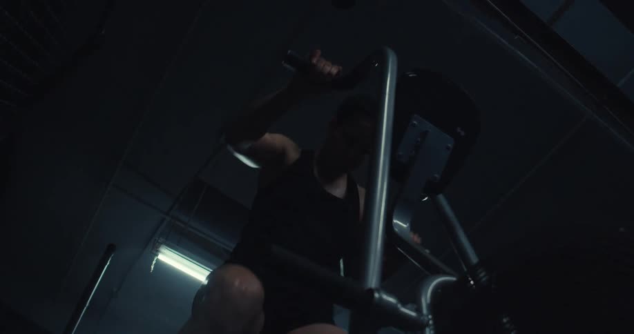 Woman doing exercise bike at high intensity