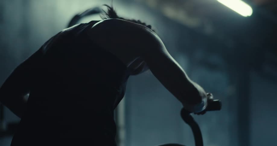 Woman on an active exercise bike in a gym