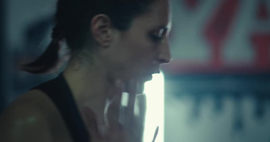 Woman in an indoor space warming up