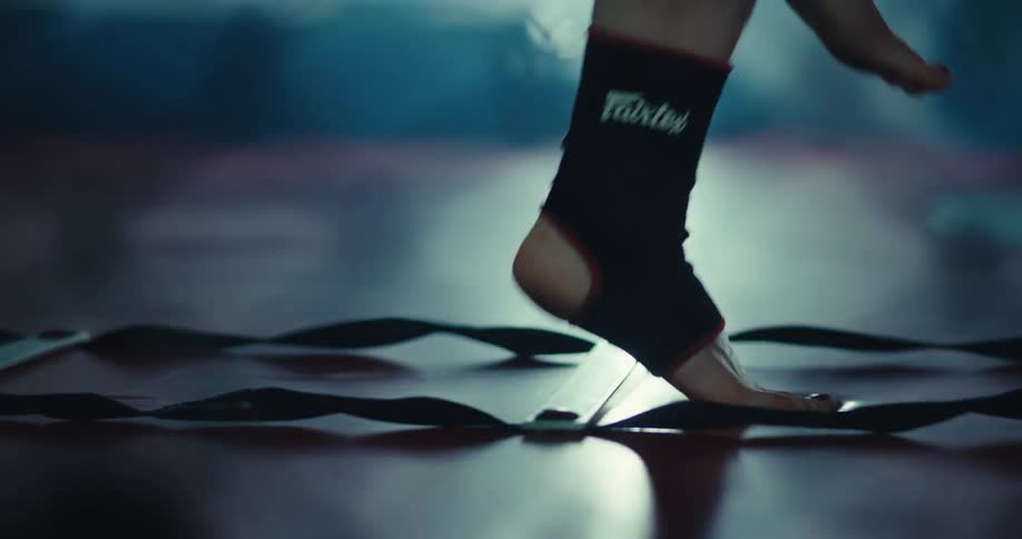Close up of a persons feet jumping in a warm up