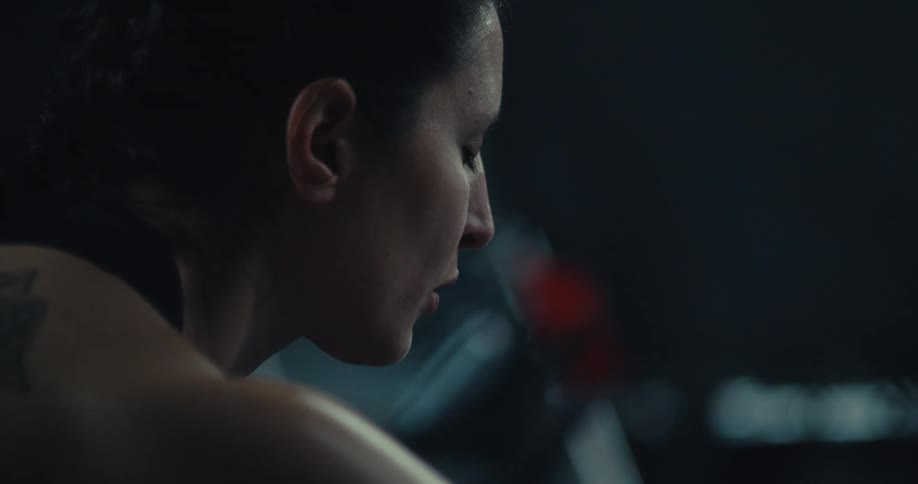 Woman with sweaty body taking deep breaths