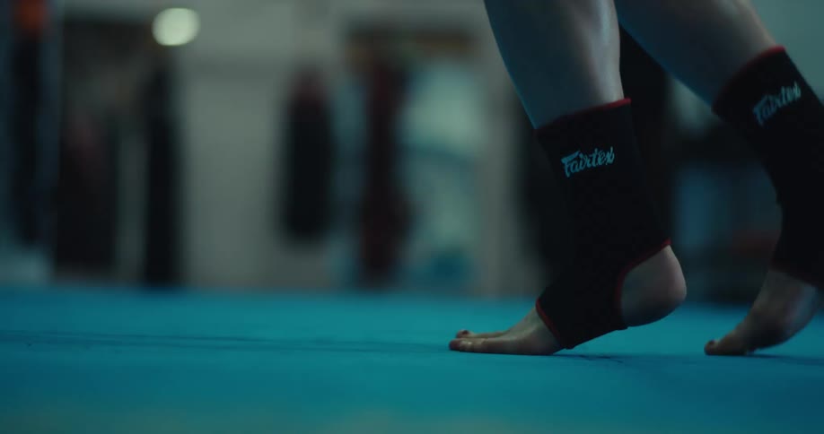 A person jumping rope stops and walks off