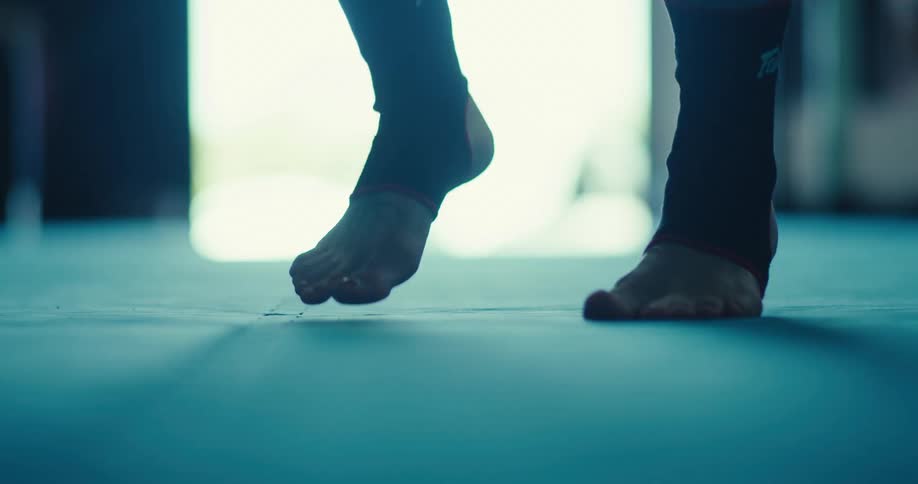 The feet of a person jumping rope