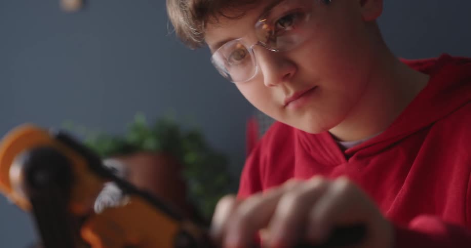 A child is fixing a device