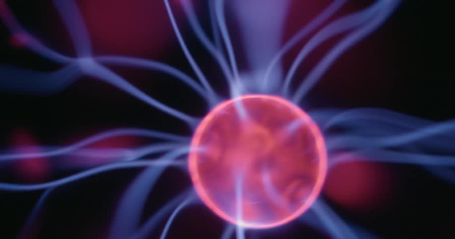 A luminous plasma ball with swirling arcs of neon light moves in a gentle bobbing motion against a dark background while each flickering electric thread pulses and glows across its surface