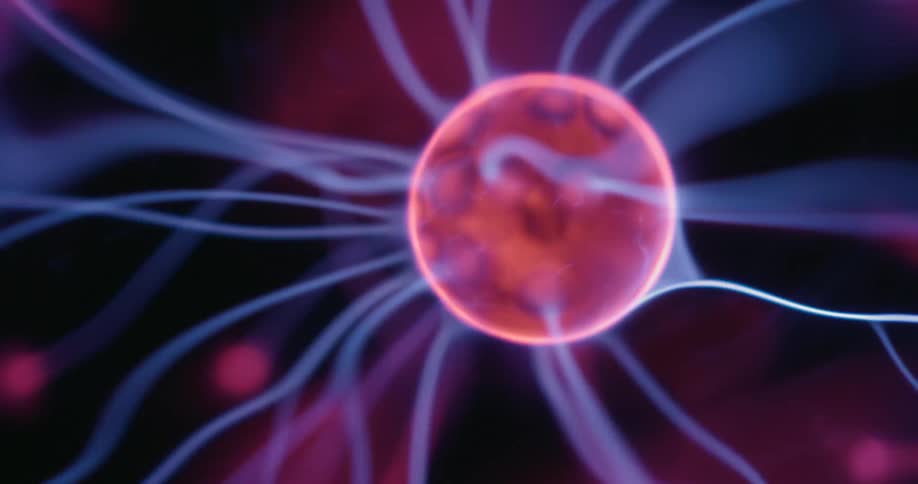 A vibrant plasma ball with orbiting arcs of neon color flickers in mesmerizing patterns as swirling lines converge on bright contact spots all set against a dark backdrop