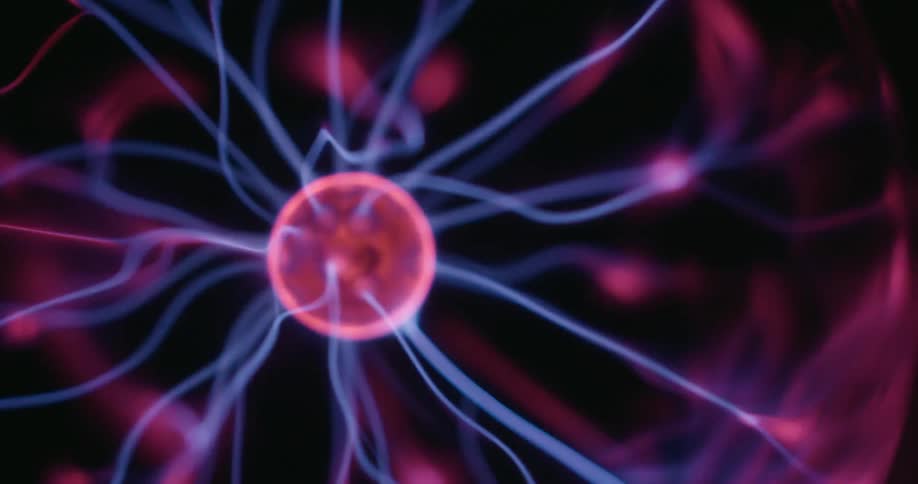 A vibrant plasma orb with swirling arcs pulses across a dark backdrop each neon thread moving fluidly as it flickers and morphs creating a mesmerizing display of continuously shifting light