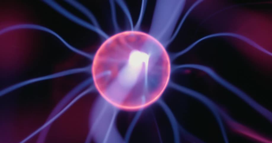 A spinning plasma orb sends streaks of energy outward in all directions briefly flashing a bright white burst before returning to its usual neon hues against the dark backdrop