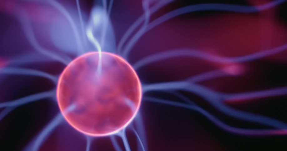 Set against a dark backdrop a plasma globes center orb emits bright neon arcs that swirl outward in mesmerizing patterns each glowing strand flickering with electric energy