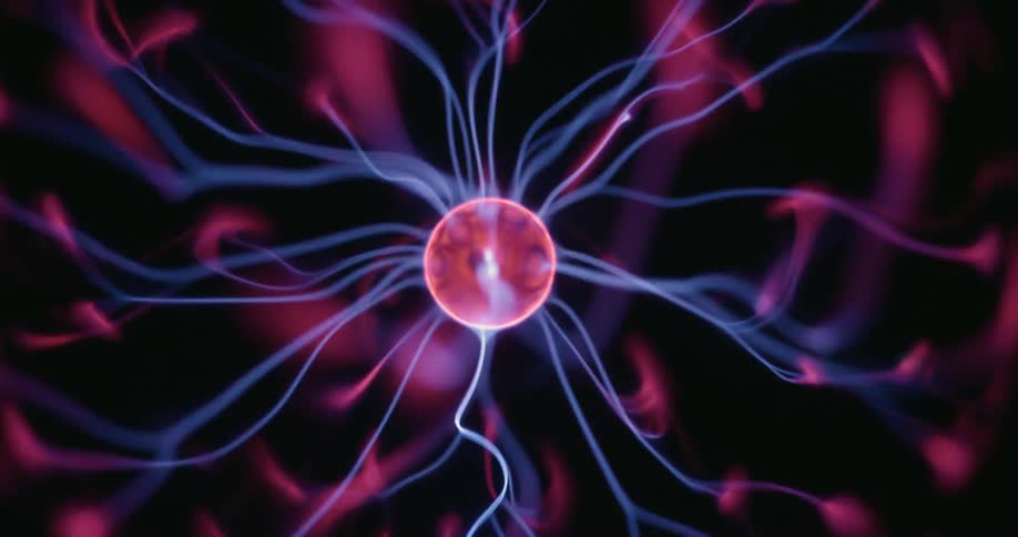 From a static vantage the plasma globes central core emits neon arcs that radiate outward in all directions flickering and intertwining across the dark backdrop in a mesmerizing display of vibrant energy