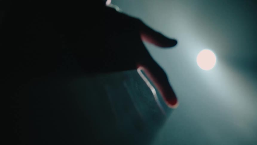 Close up of a palm of a hand against a studio light