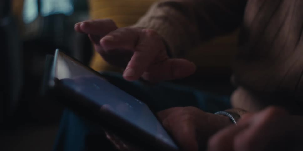 A footage of two people operating a tablet