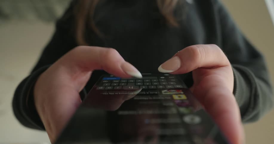 A woman is texting on a cellphone