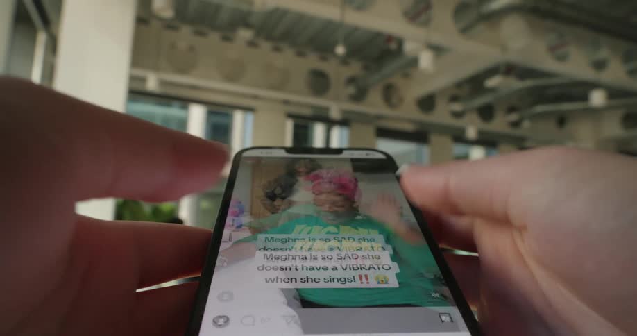 Pair of hands browsing a smartphone screen