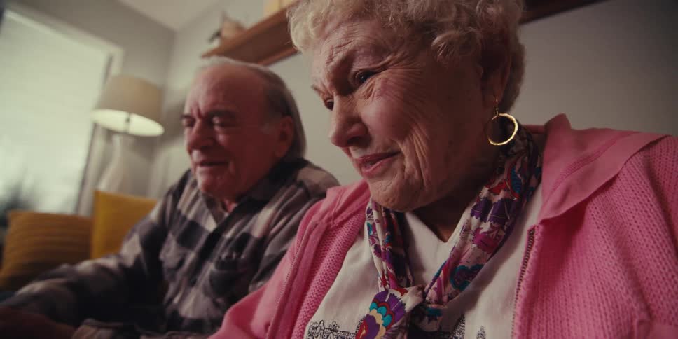 Grandma and grandpa are having fun while chatting with their grandchildren online