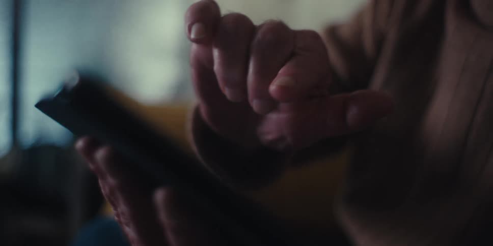 A footage of a person operating a smartphone