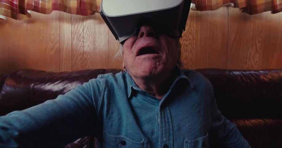 A footage of an elderly man playing virtual reality