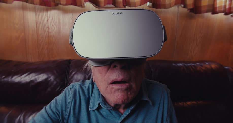 A man is amazed as he uses a virtual reality headset
