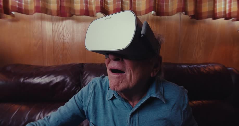 Older person amazed by the virtual reality goggles hes wearing