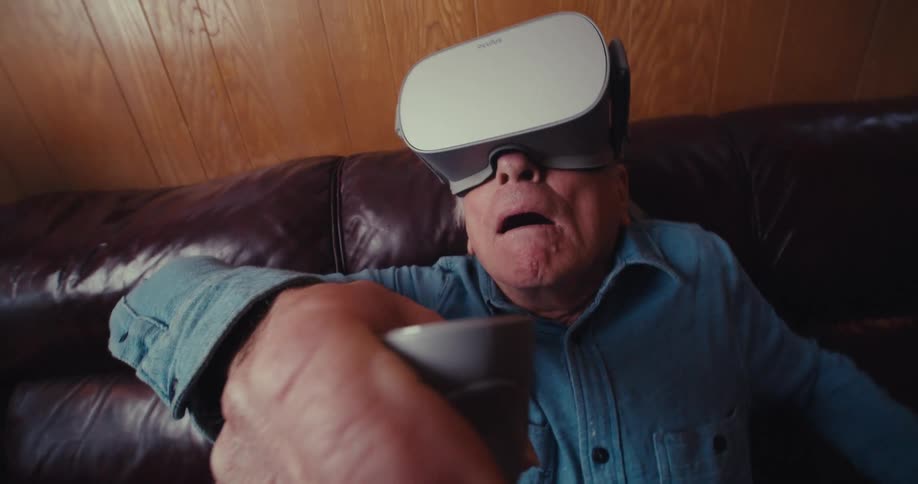 A man is amazed as he uses a virtual reality headset