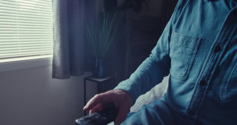A footage of an elderly man operatinghone