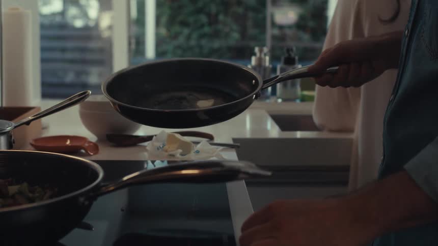 A footage of a person cooking in the kitchen