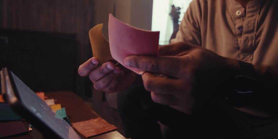 Pair of hands of a person holding a fabric