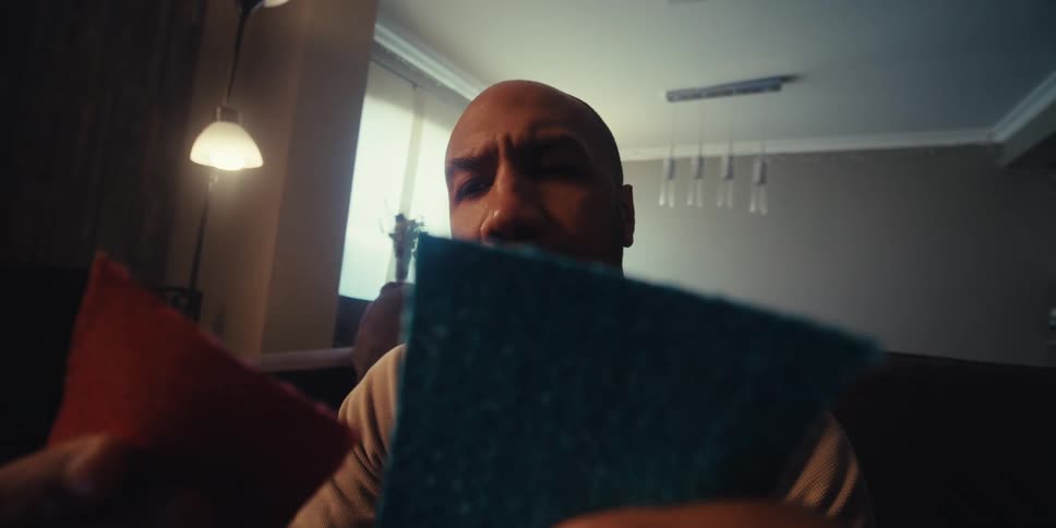 Man analyzing the color palette of two small fabrics