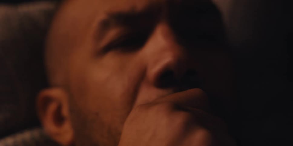 A footage of a man holding a smartphone