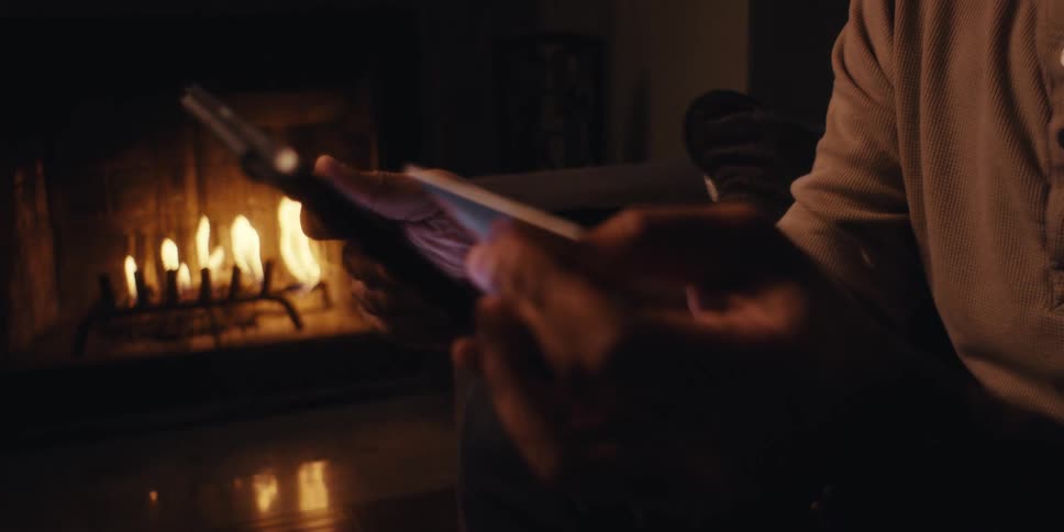 A footage of a person holding a smartphone and a card