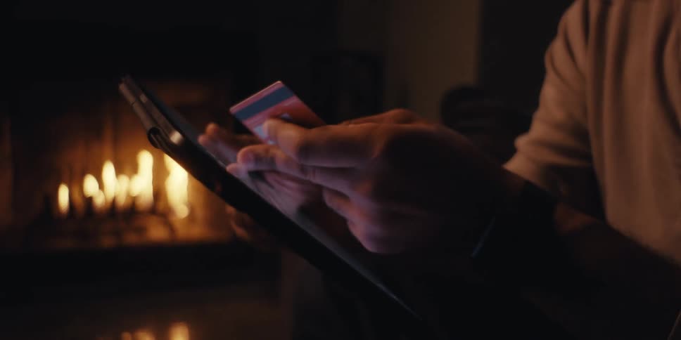 A man taps on a tablet