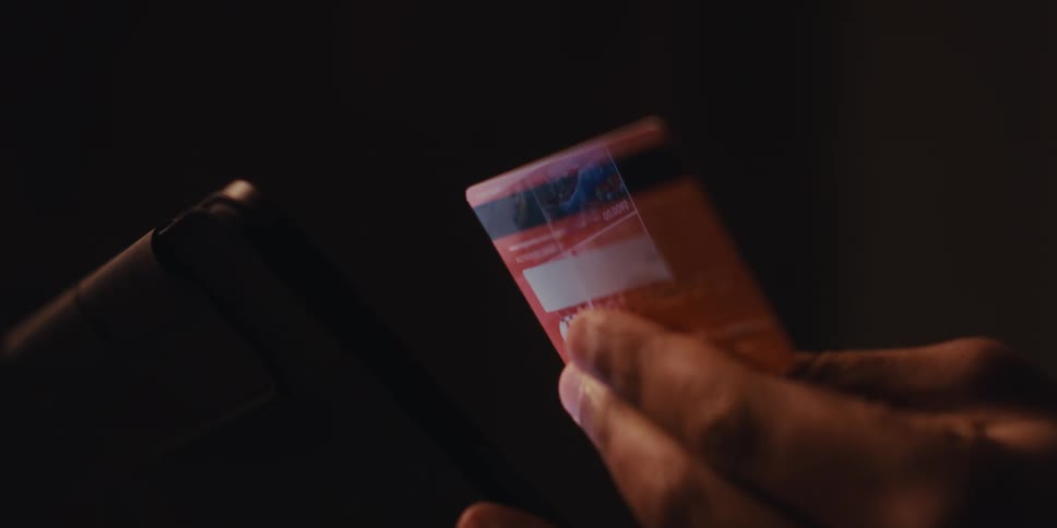 A person holds a credit card