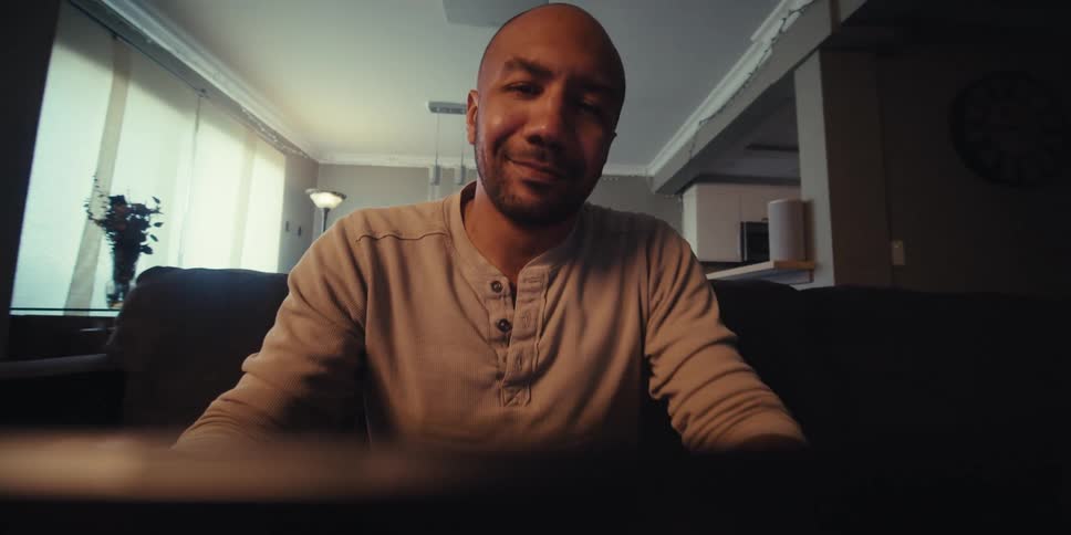 Portrait of a man interacting with a digital device