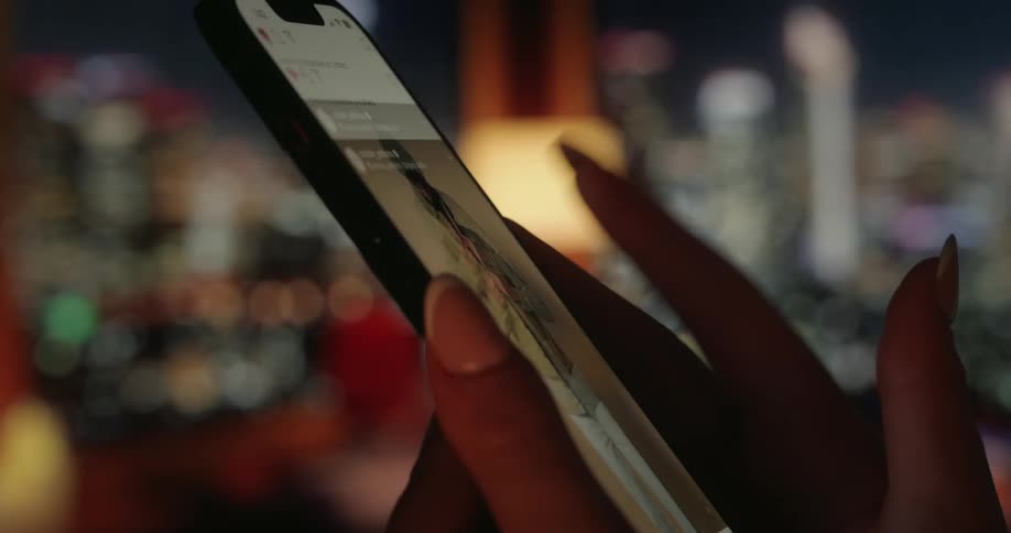 A person is using a cellphone to scroll the internet
