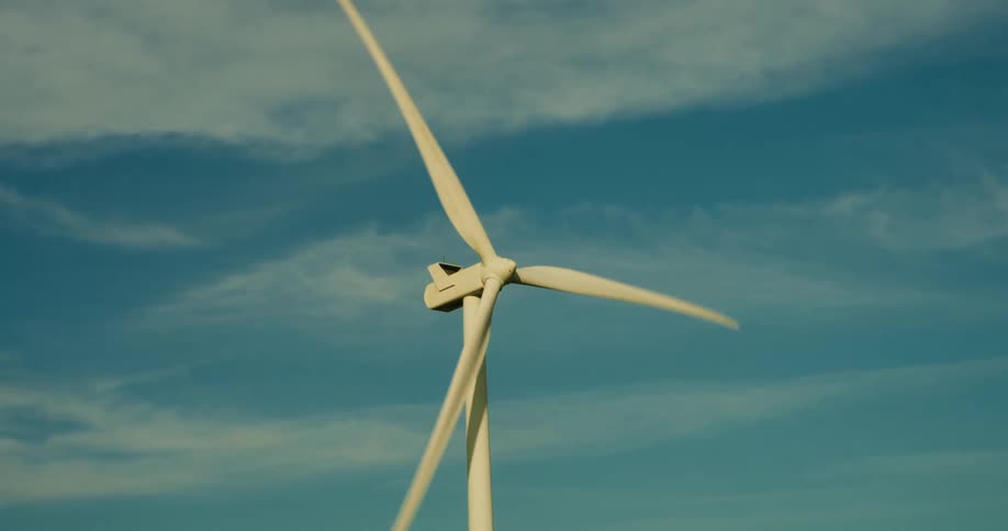 The blades on the windmill are spinning