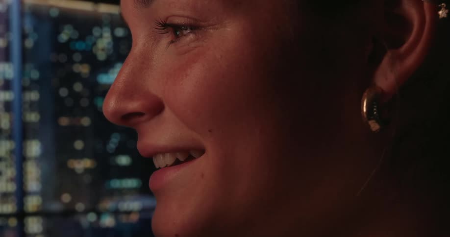 Side portrait of a smiling woman