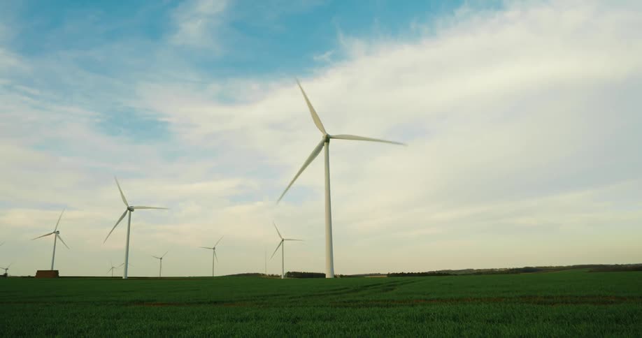 Wind turbines rotating on a wind farm generating energy