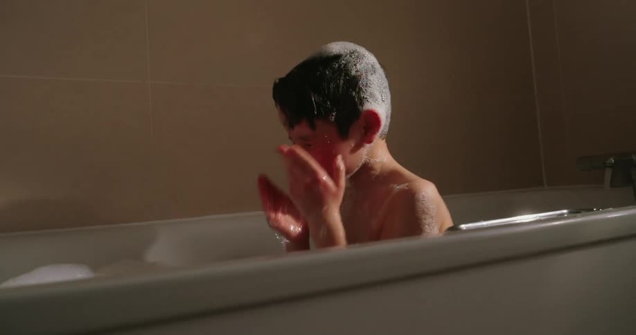 Boy taking a bath in the bathtub