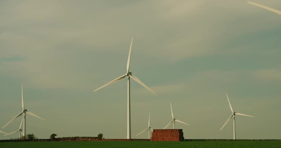 Turbines spinning in a field